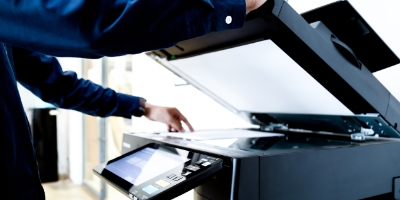 Person using a printer photocopier following Managed Print Services being provided