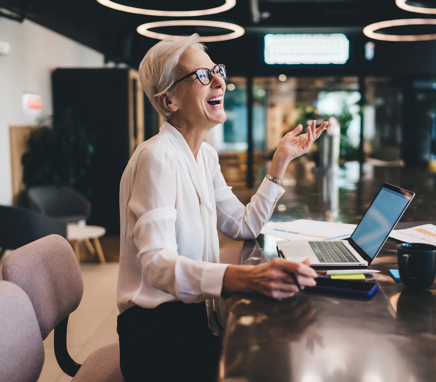 laughing businesswoman working with a colleague